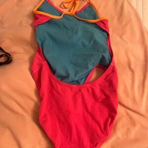 Vibrant Pink and Blue Swimsuit with Orange Trim